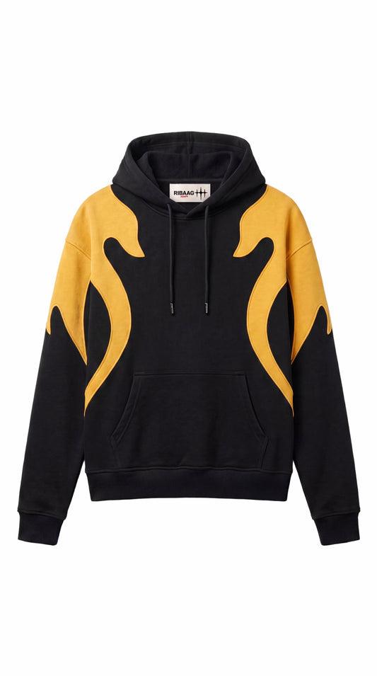 Black oversized hoodie with yellow flame panels across shoulders by Ribaag